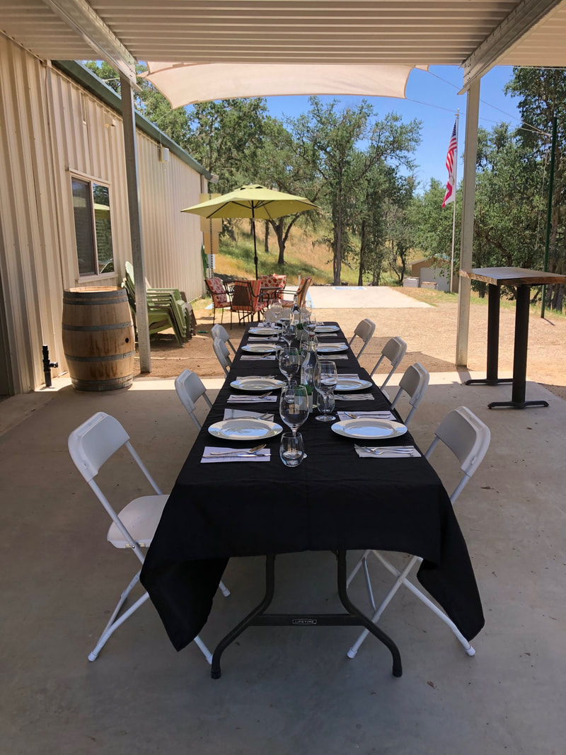 Picture of table setting outside of the Soaring Hawk tasting room.